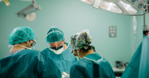 Surgeons operating in a hospital theatre 